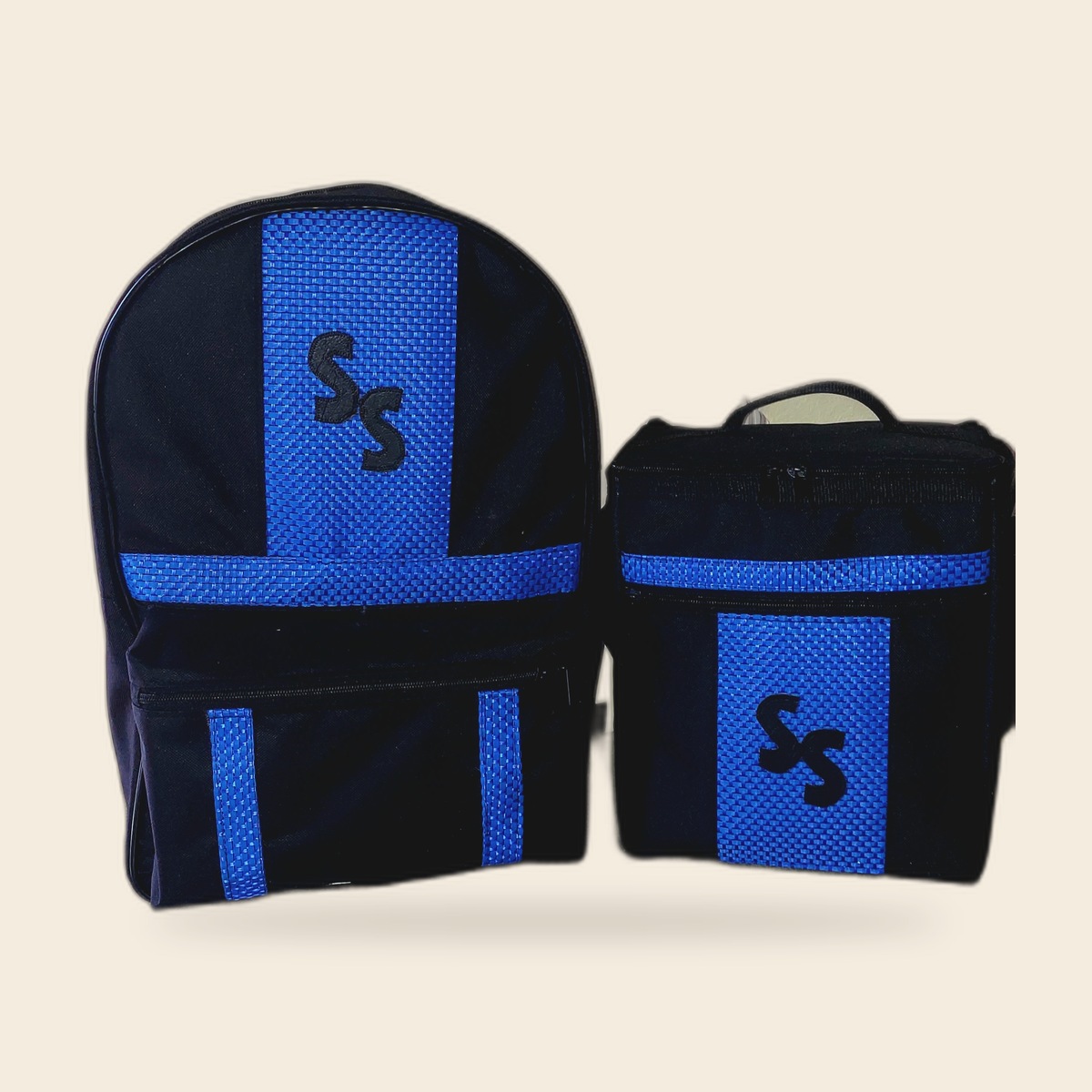 Named lunch and backpack set on cream studio