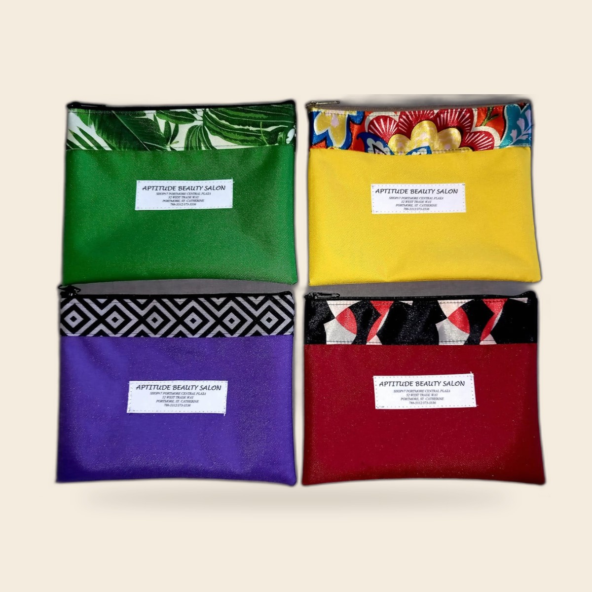 Aptitude Beauty Salon branded zip pouches in a matched set