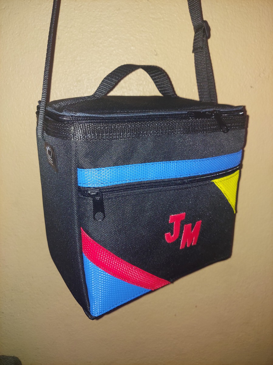 JM monogram lunch bag with yellow, red, and blue accents